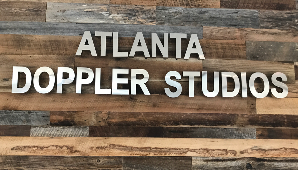 Picture of company sign in business lobby.